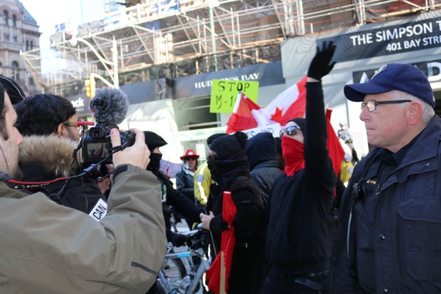 Confrontation in Toronto between M103 supporters and those against -Police control opposing groups - Photo Mosaic Edition Edward Akinwunmi