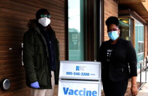 Vaccine clinic – people with disabilities – Hamilton A priority COVID-19 Vaccination clinic for people with disabilities took place today at the Hamilton Public Library – Barton Branch. Kojo Damptey, Interim Executive Director Hamilton Centre for Civic Inclusion and Terri Bedminster Executive Director Refuge Newcomer - Photo Mosaic Edition Edward Akinwunmi