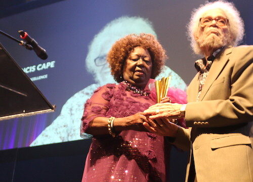 Jean Augustine presents the CTFF inaugural Augustine Award of Excellence to Roy Cape shortly after the screening of the documentary Iconography - Photo Mosaic Edition Edward Akinwunmi